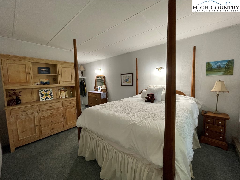 911 Pine Ridge Road Beech Mountain, NC 28604 - Photo 8 of 22 a bed room with a bed and a tv