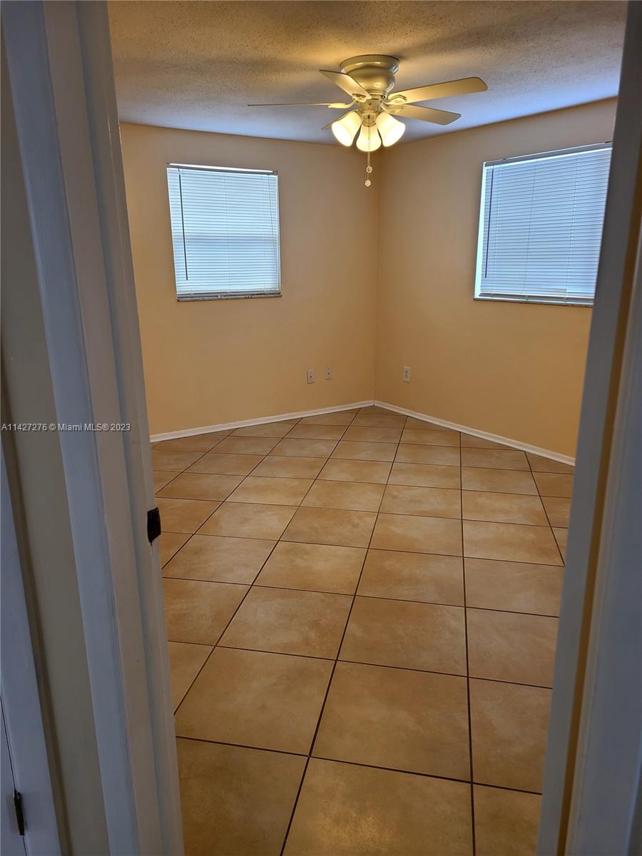 11204 Harding Drive Port Richey, FL 34668 - Photo 2 of 6 a view of an empty room with a window