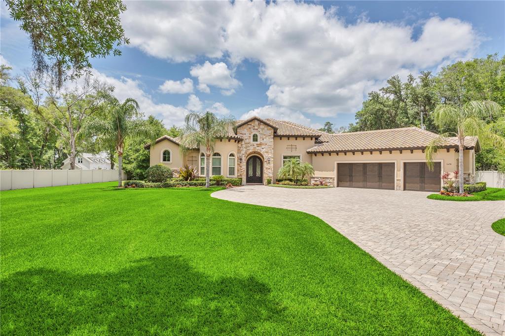 a front view of a house with garden and porch
