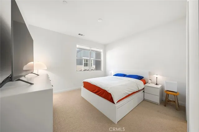 a living room with a bed and a window