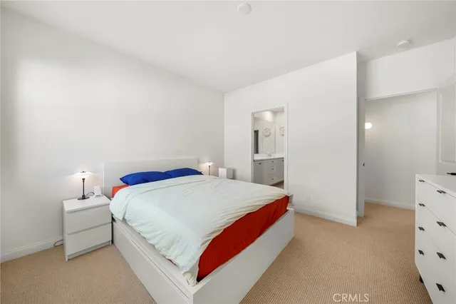 a bedroom with a bed and closet