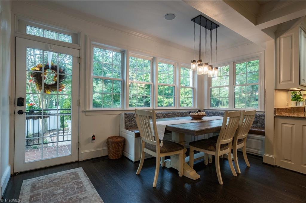 211 Dutchman Creek Road Elkin, NC 28621 - Photo 14 of 42 Dining area with French door and bank of windows overlooking back patio. Photos taken Oct. 2025