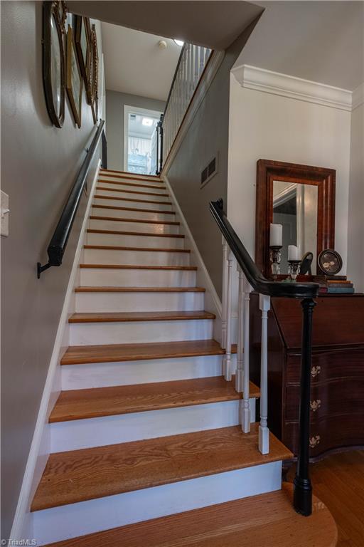 211 Dutchman Creek Road Elkin, NC 28621 - Photo 23 of 42 Staircase leading to the second level. Photos taken Oct. 2025