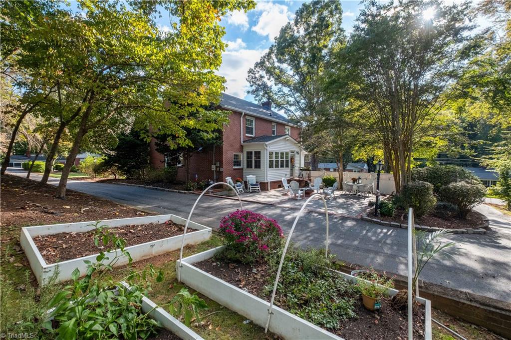 211 Dutchman Creek Road Elkin, NC 28621 - Photo 38 of 42 Side yard with raised beds. Photos taken Oct. 2025
