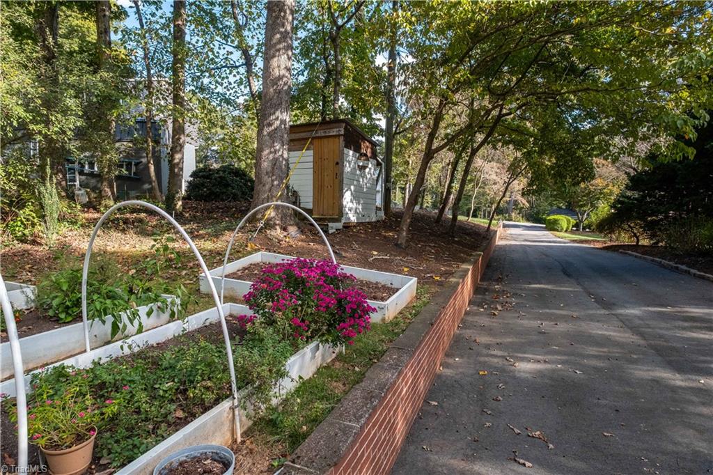 211 Dutchman Creek Road Elkin, NC 28621 - Photo 39 of 42 Side yard with raised beds. Photos taken Oct. 2025