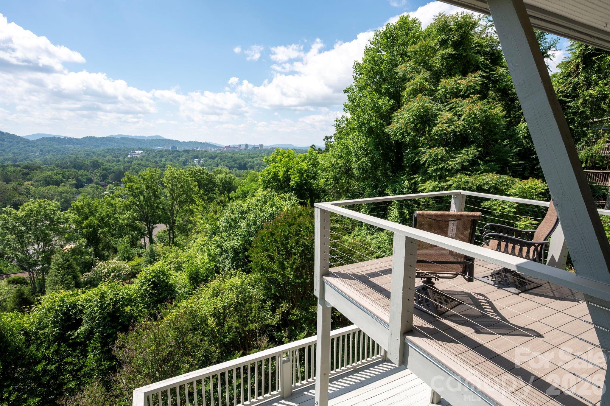 38 Lookout Road Asheville, NC 28804 - Photo 26 of 34 a view of a balcony with wooden floor and fence