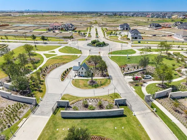 a view of a swimming pool with a dining table and chairs