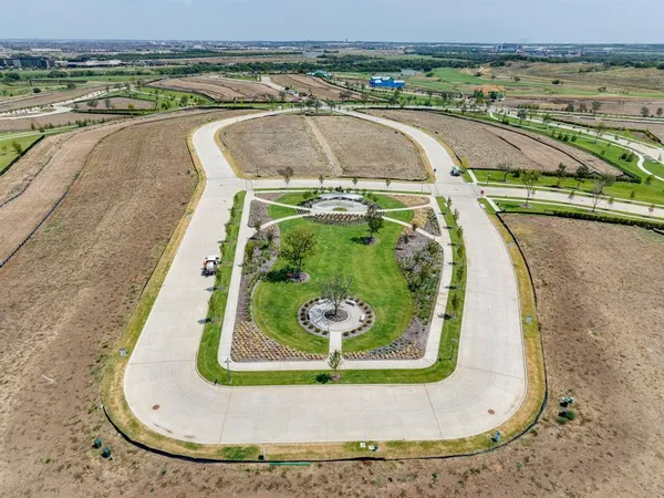 an aerial view of a residential apartment building with a yard