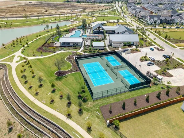 an aerial view of a house with a swimming pool