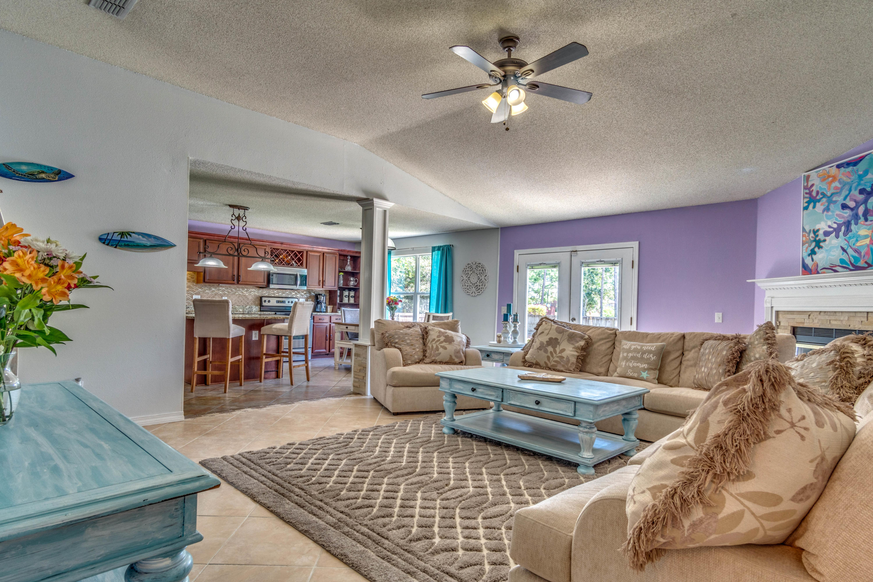 7105 Snug Waters Road Navarre, FL 32566 - Photo 17 of 42 a living room with furniture and a rug