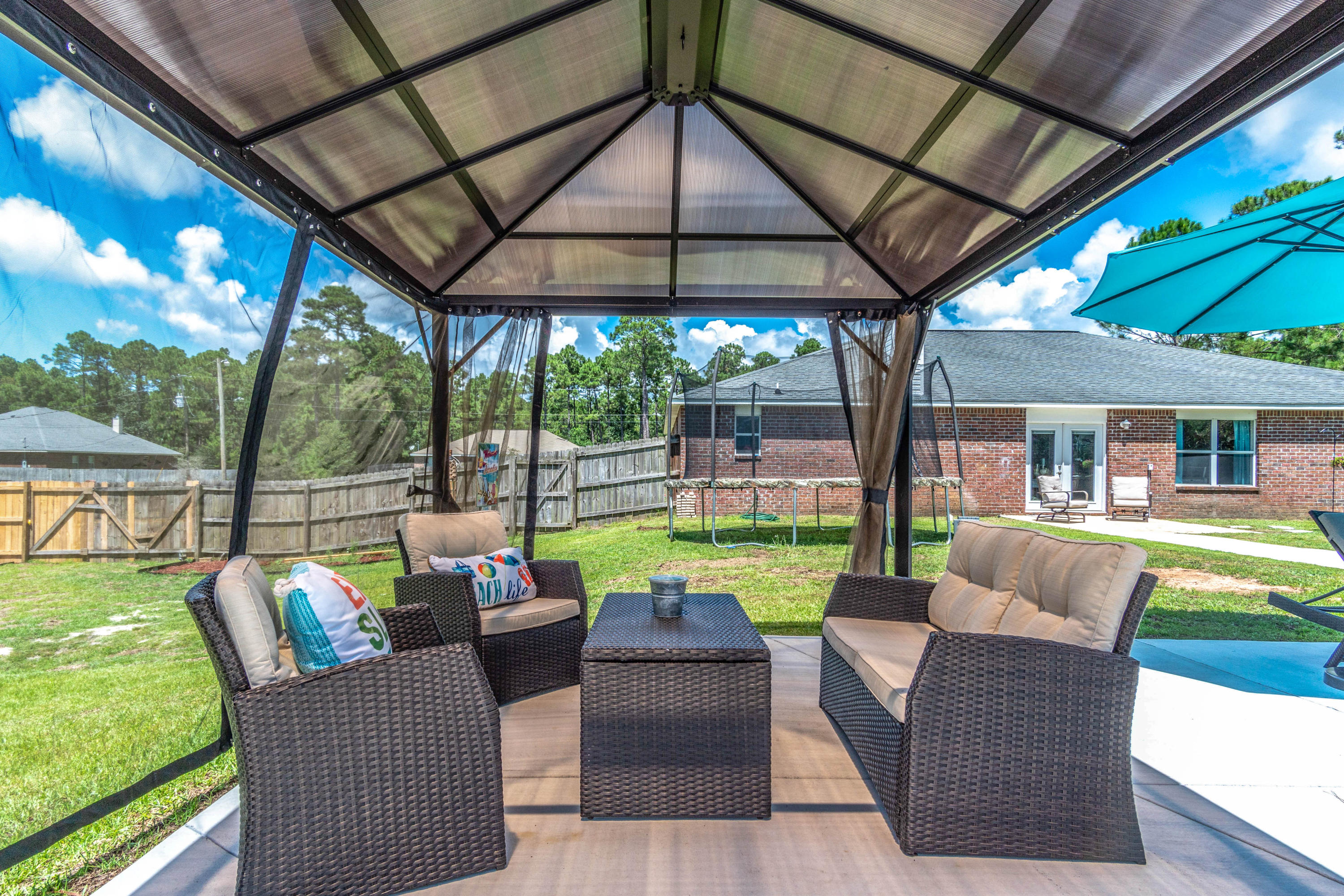 7105 Snug Waters Road Navarre, FL 32566 - Photo 3 of 42 a view of an outdoor sitting space
