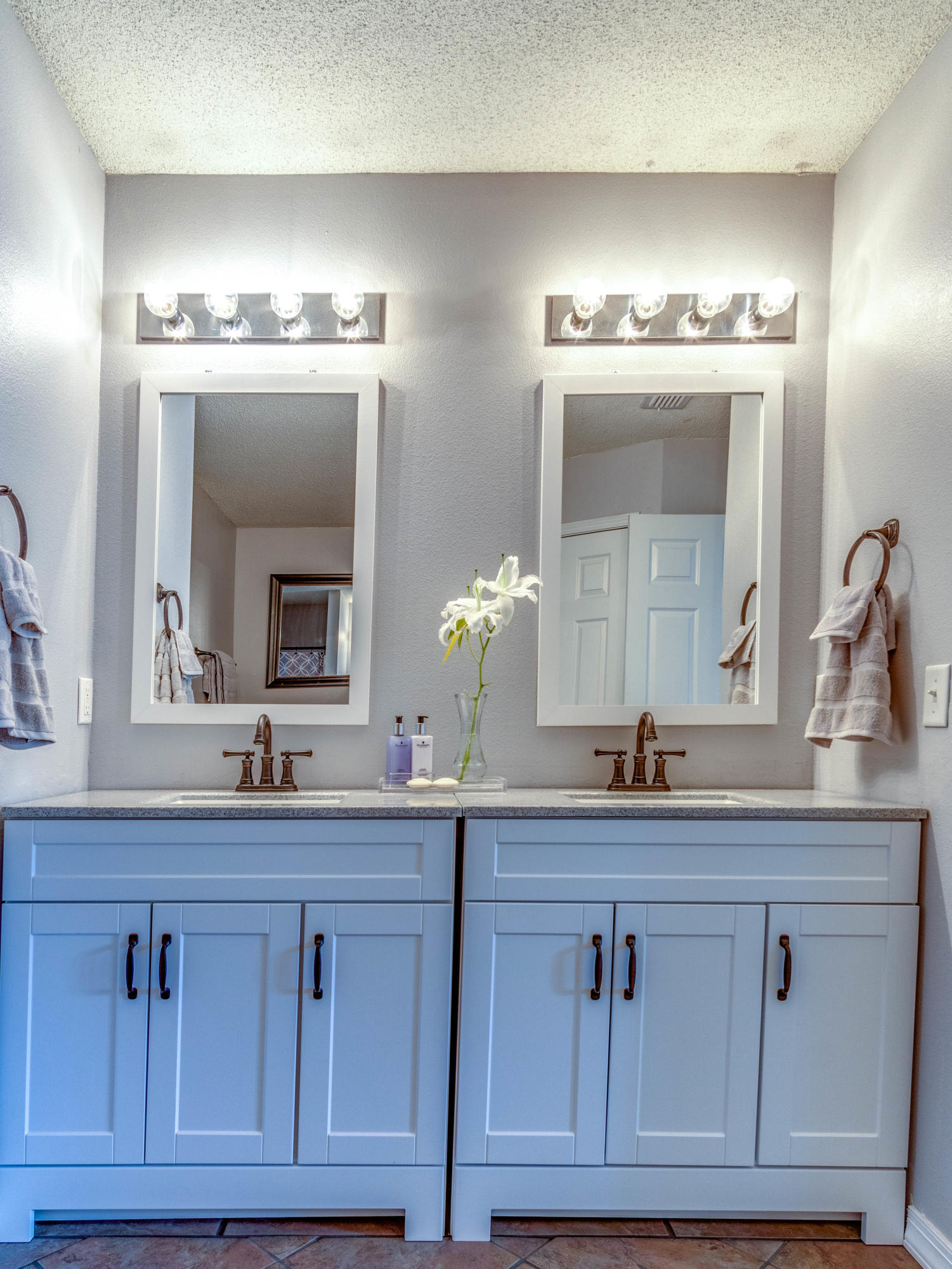 7105 Snug Waters Road Navarre, FL 32566 - Photo 36 of 42 a bathroom with double sink and a mirror