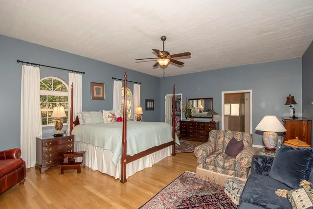 a bed room with furniture and a fireplace
