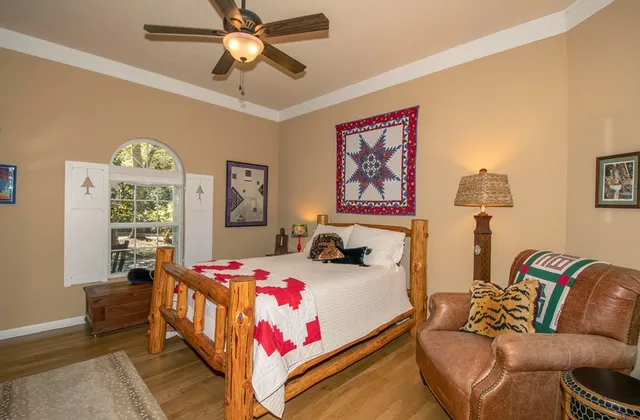 a bedroom with a bed and a couch