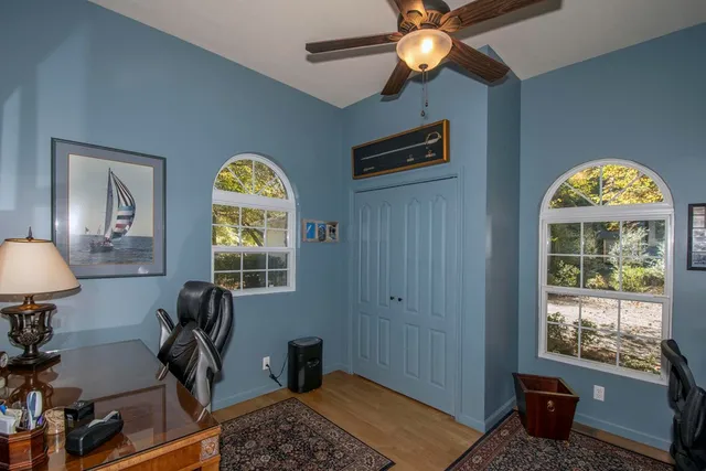 a workspace with furniture and window