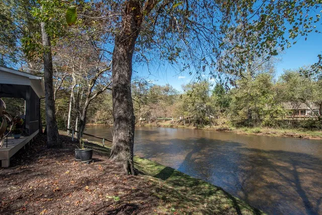 a view of outdoor space with deck and tree