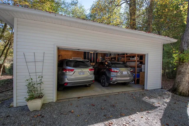 a view of a cars in front of a house