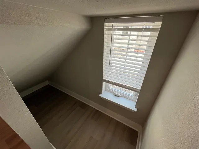 a view of an empty room and window