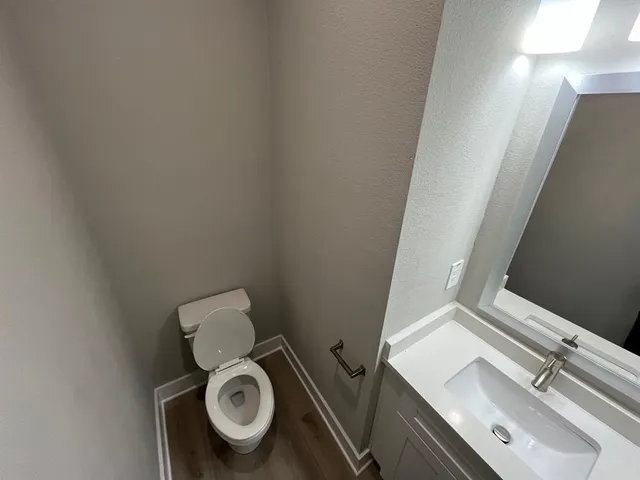 a view of hallway with wooden floor