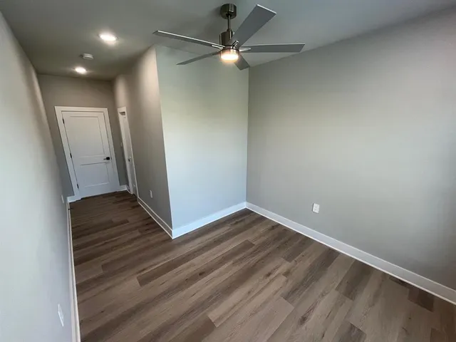 a bathroom with a sink mirror and vanity
