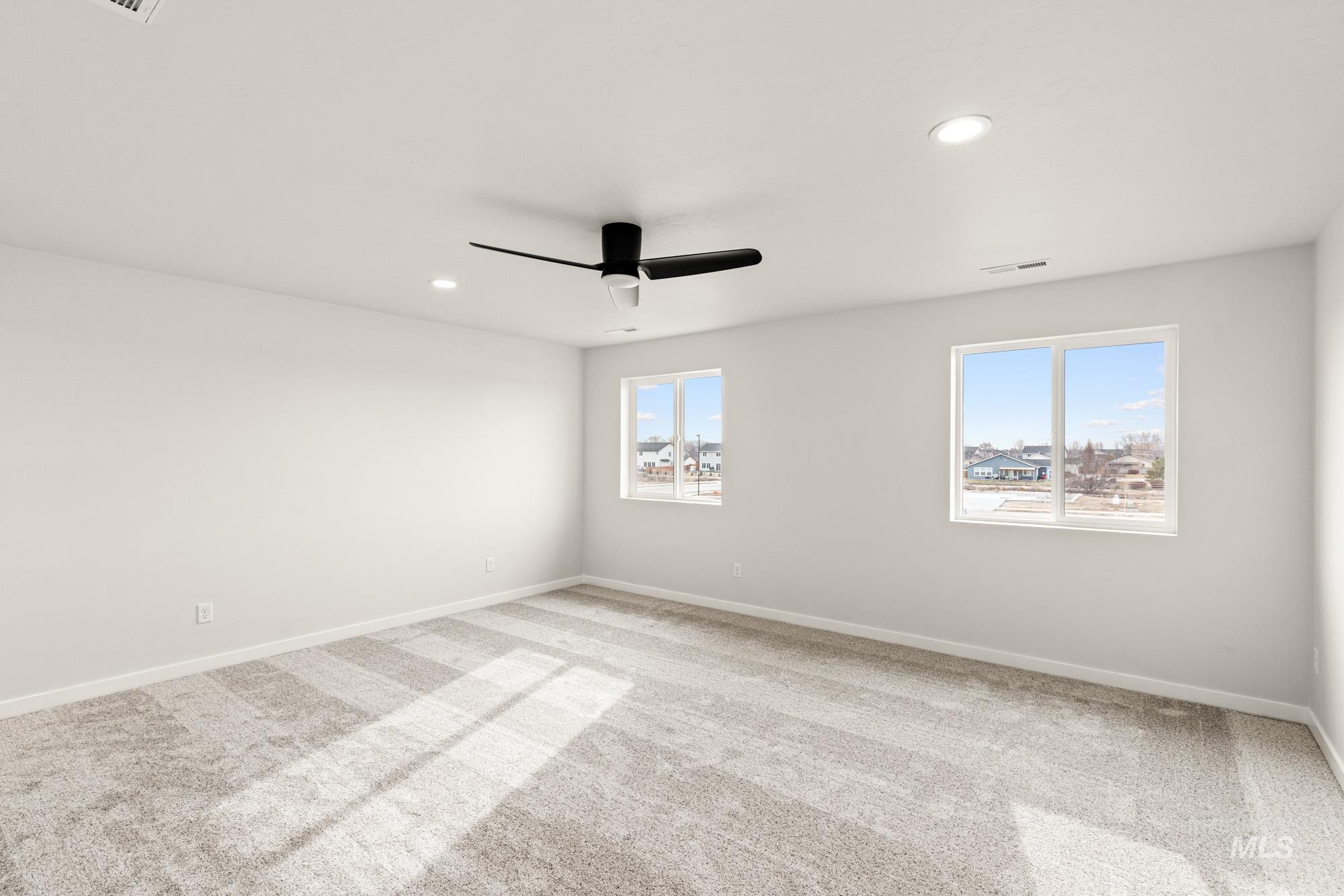 1533 Long Pond Street Middleton, ID 83644 - Photo 16 of 21 Carpeted empty room featuring recessed lighting and ceiling fan