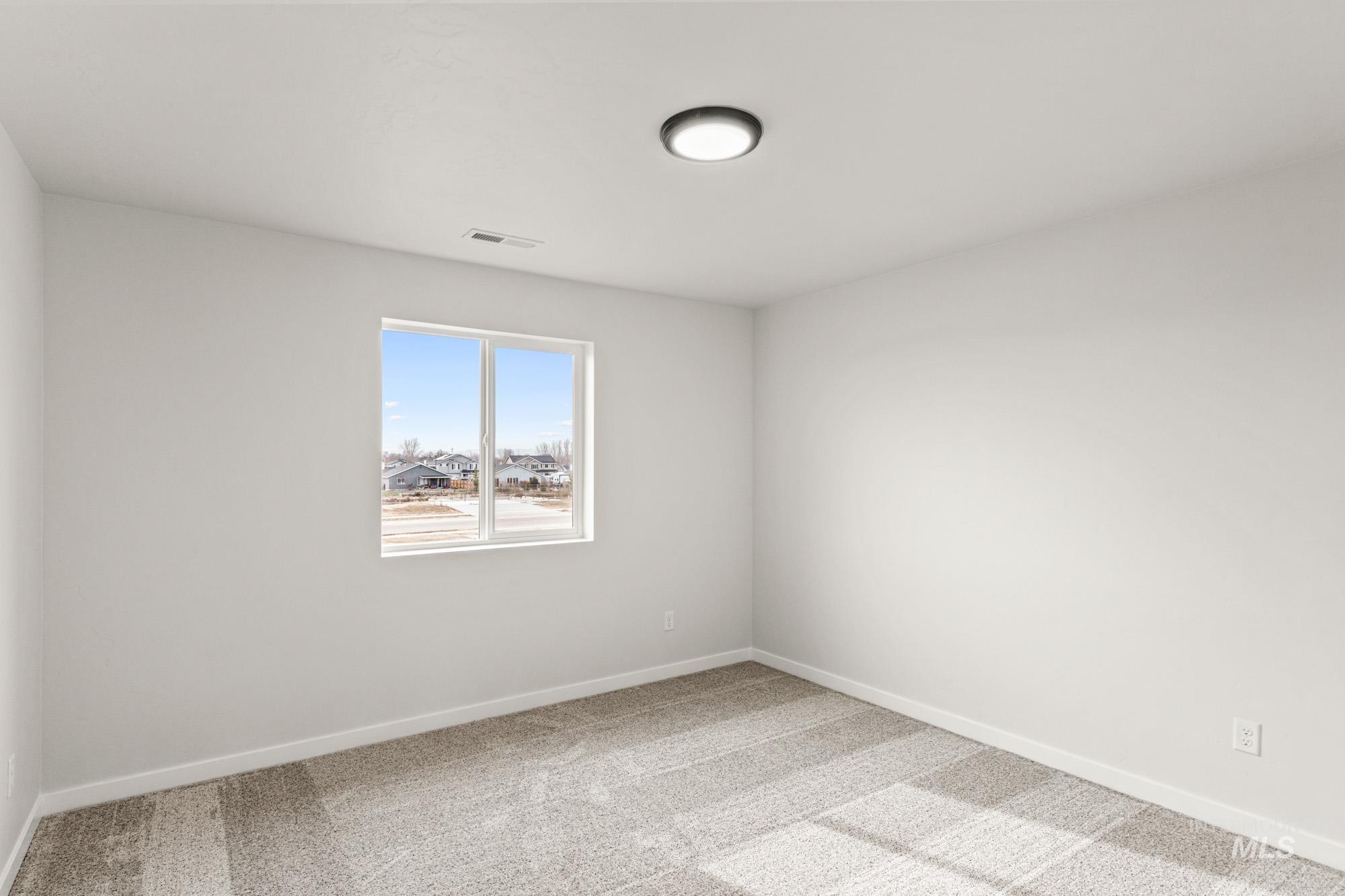1533 Long Pond Street Middleton, ID 83644 - Photo 21 of 21 Empty room with light carpet and baseboards