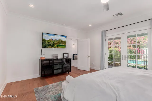 a bed room with furniture and window
