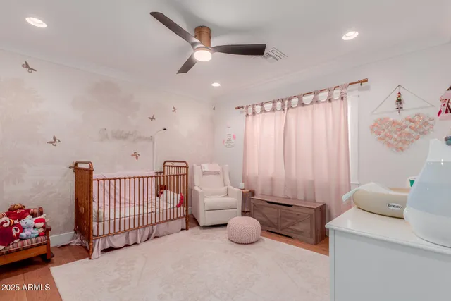 a bedroom with furniture and a chandelier