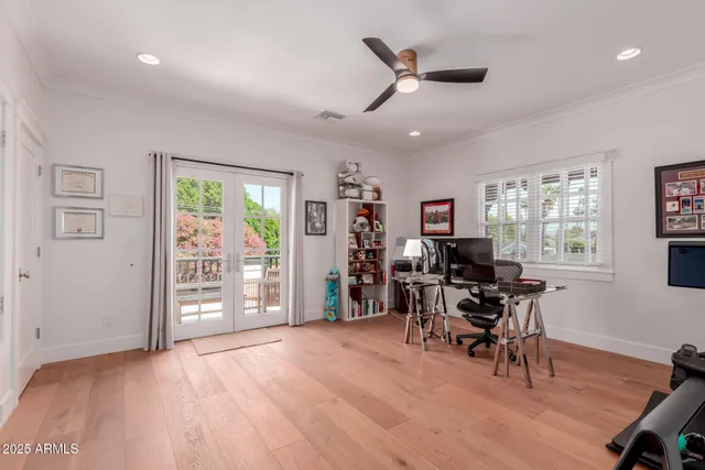 a view of a livingroom with workspace and a window