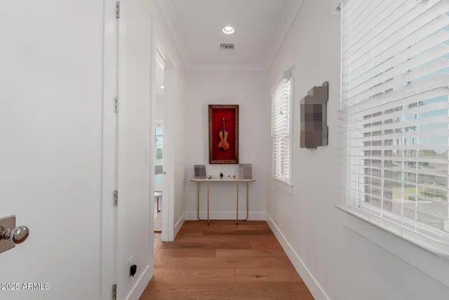 a view of hallway with windows