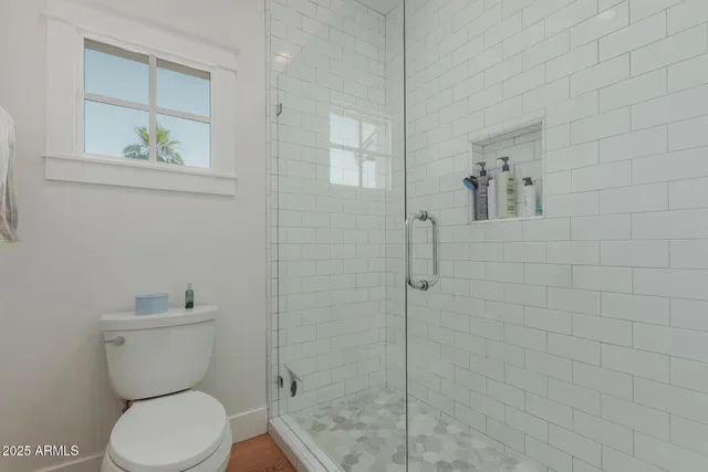 a view of a patio with table and chairs and potted plants