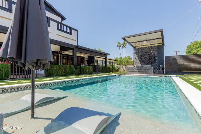 a view of a house with a yard porch and sitting area