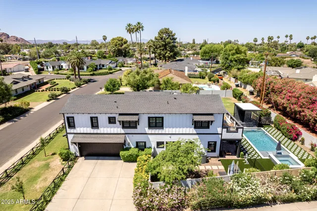 an aerial view of a house with a swimming pool