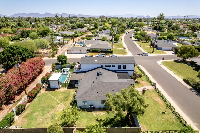 an aerial view of residential houses with outdoor space