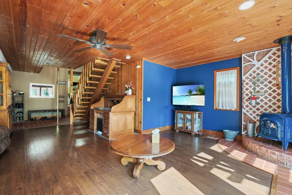 a kitchen with granite countertop stainless steel appliances white cabinets granite counter tops and a window