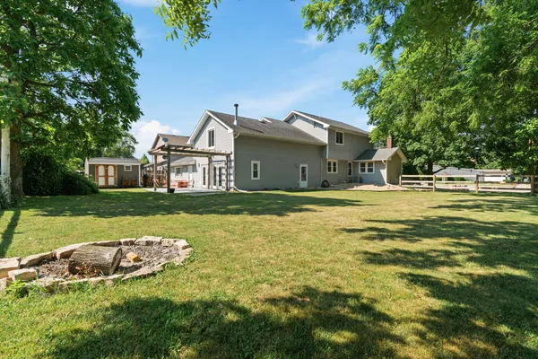 an aerial view of a house with a yard