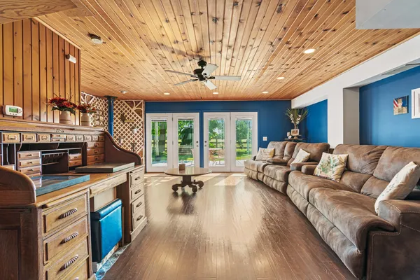 a view of a livingroom with furniture and wooden floor