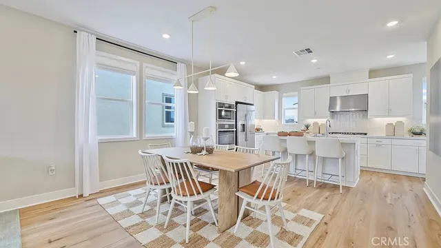 a kitchen with stainless steel appliances kitchen island granite countertop a sink and cabinets