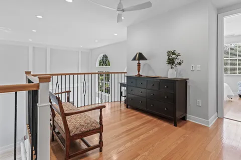 a view of room with furniture and wooden floor