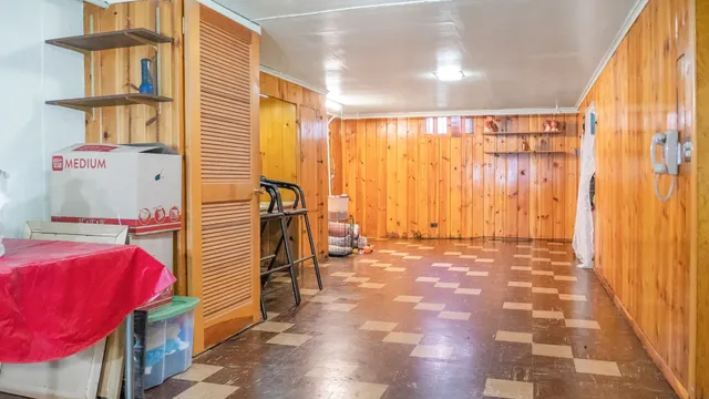 a view of a bedroom with furniture and a window