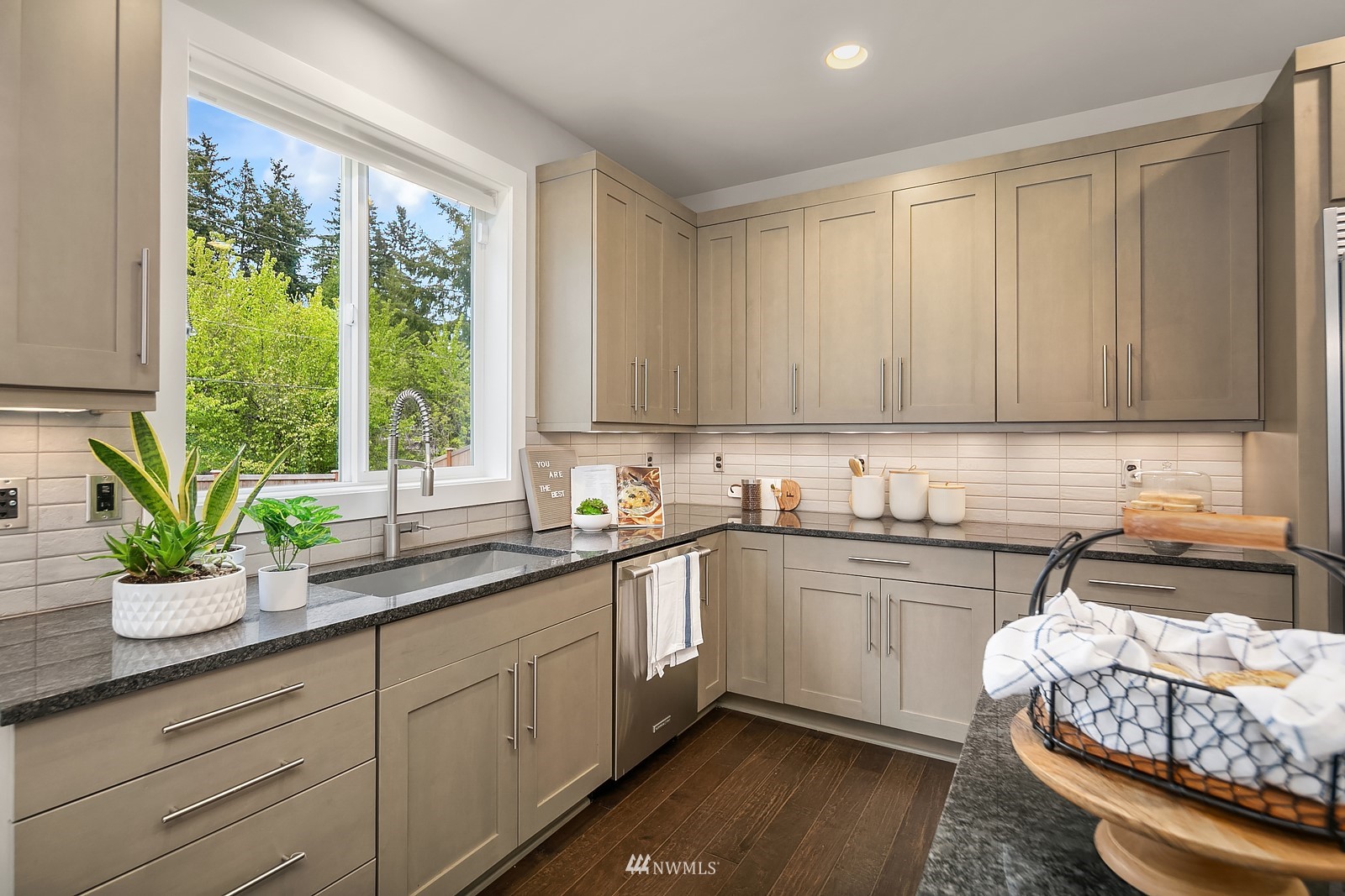 103 236th Place Southeast Bothell, WA 98021 - Photo 11 of 37 a kitchen with a sink a window cabinets and a counter space