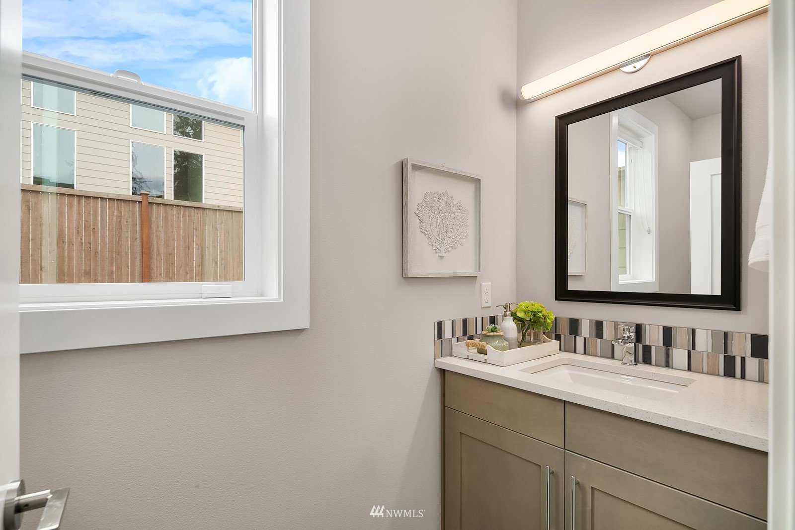 103 236th Place Southeast Bothell, WA 98021 - Photo 15 of 37 a bathroom with a sink vanity and mirror