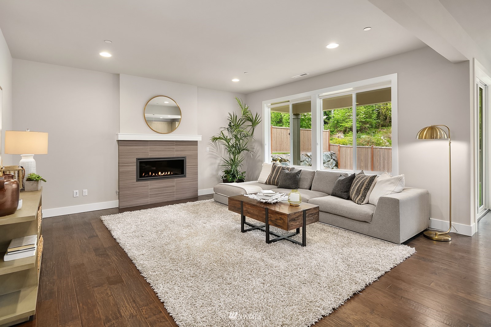 103 236th Place Southeast Bothell, WA 98021 - Photo 3 of 37 a living room with furniture and a fireplace