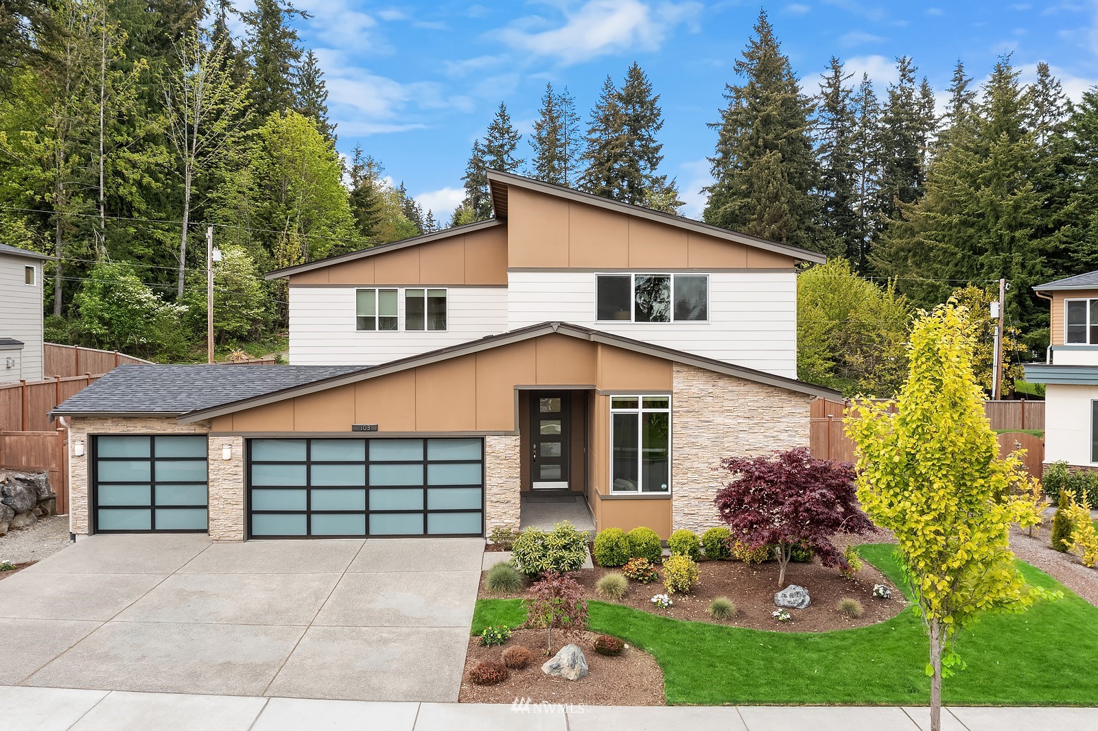 103 236th Place Southeast Bothell, WA 98021 - Photo 31 of 37 a front view of a house with a garden and plants