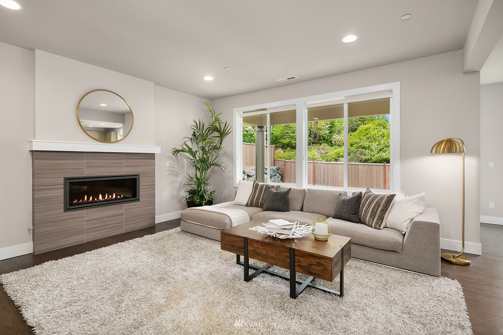 103 236th Place Southeast Bothell, WA 98021 - Photo 4 of 37 a living room with furniture and a fireplace