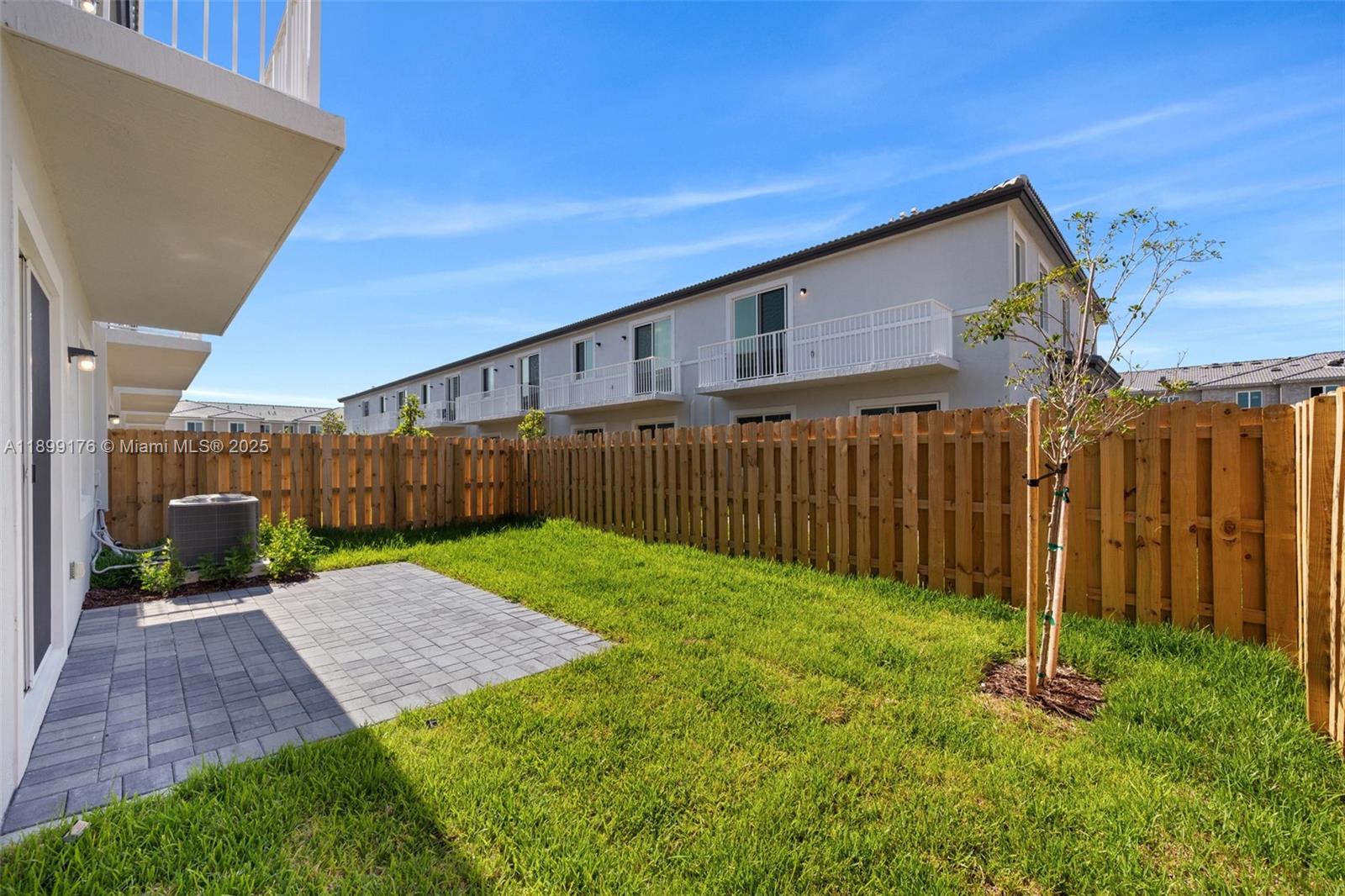 715 Southeast 15th Street Homestead, FL 33034 - Photo 17 of 33 a view of a backyard with wooden fence