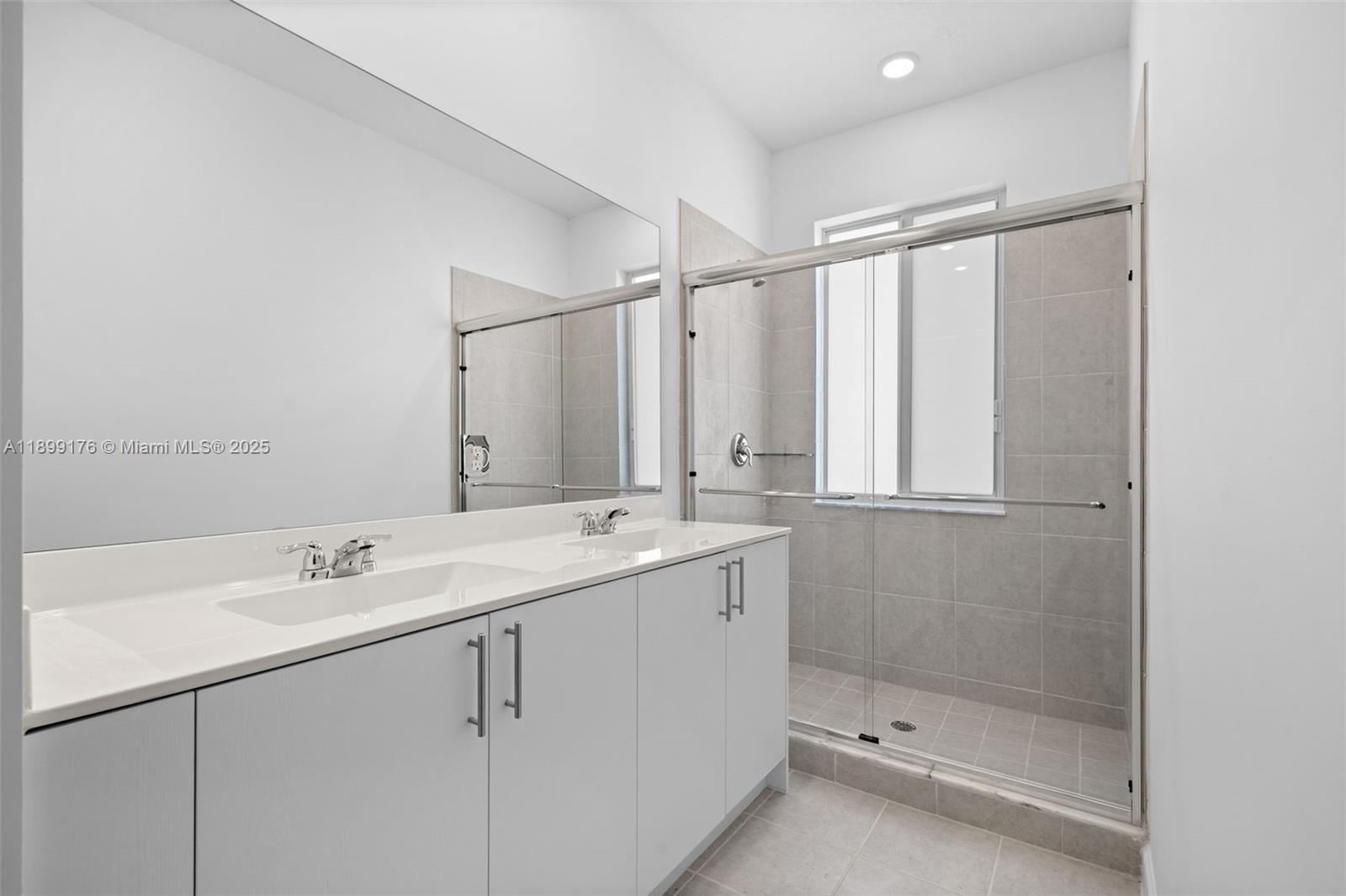 715 Southeast 15th Street Homestead, FL 33034 - Photo 22 of 33 a bathroom with a shower sink and mirror