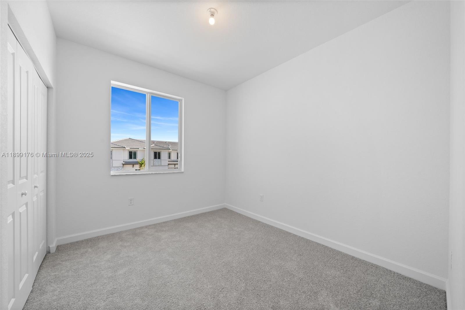 715 Southeast 15th Street Homestead, FL 33034 - Photo 25 of 33 an empty room with a empty space and windows