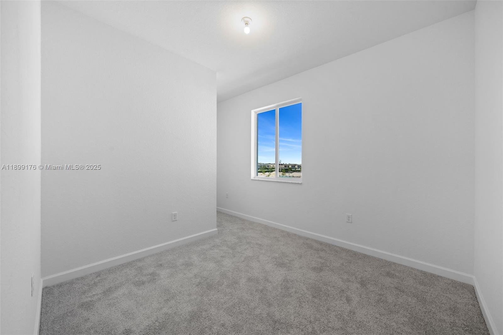 715 Southeast 15th Street Homestead, FL 33034 - Photo 27 of 33 a view of an empty room and a window