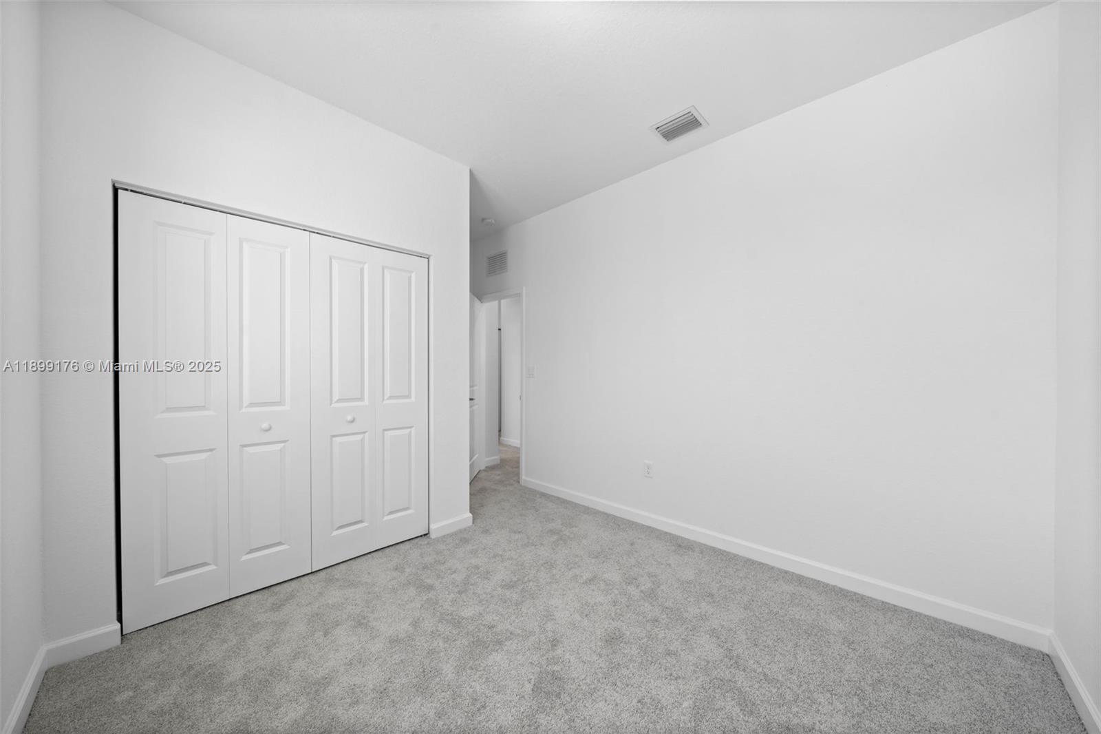 715 Southeast 15th Street Homestead, FL 33034 - Photo 31 of 33 an empty room with closet area